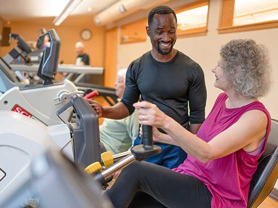 Resident using the exercise equipment at Foxdale Village