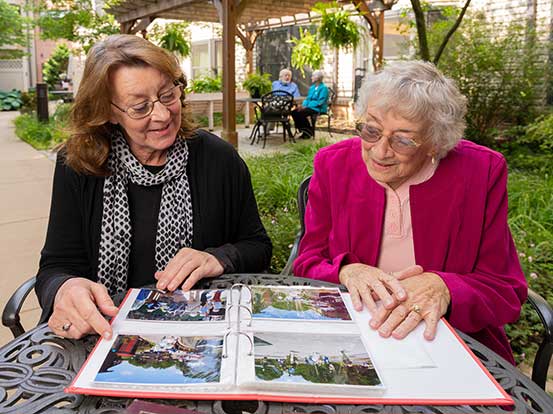 Residents looking through photo album