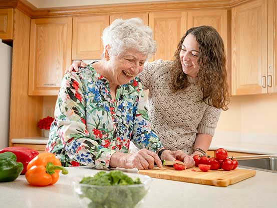 Resident preparing a meal at Foxdale Village