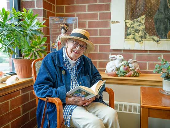 Resident reading at Foxdale Village